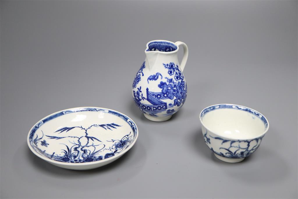 A Worcester Candle Fence tea bowl & saucer, c.1765 and a The Bat sparrow beak milk jug, c.1785,